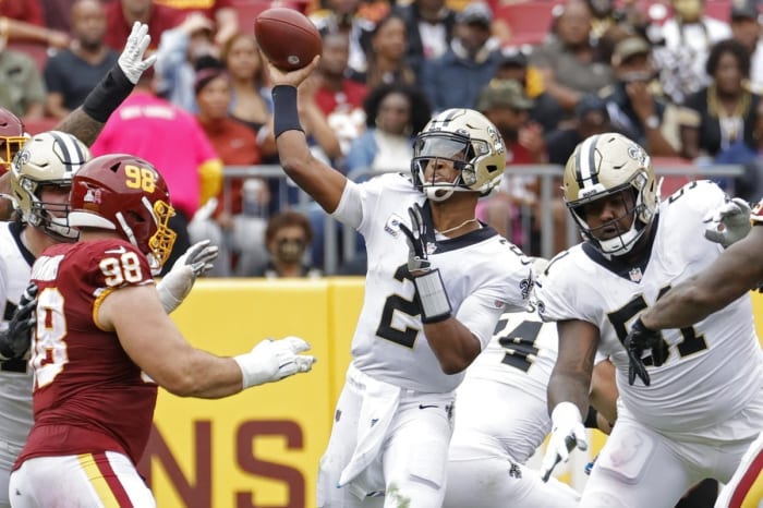 Saints quarterback Jameis Winston (2) passes the ball as Washington defensive tackle Matthew Ioannidis (98) defends. Mandatory Credit: Geoff Burke-USA TODAY Sports